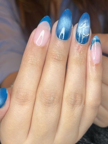 A close-up of the blue cat eye and chrome flower detail.