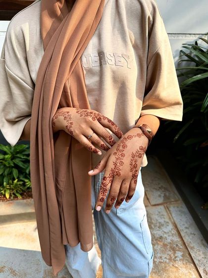 This is the same scattered floral design, showing how beautifully the natural henna stain develops into a warm, earthy tone on the skin.