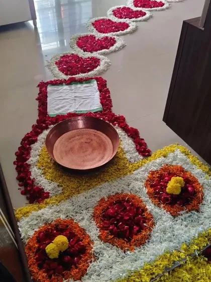 A traditional welcome home ceremony decoration for a newborn. I can create beautiful floor arrangements using flower petals to honor cultural traditions like Griha Pravesh for the baby.