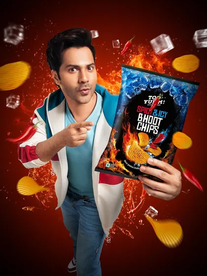 A vibrant and dynamic campaign image for Too Yumm featuring Varun Dhawan. For food and snack brands, I focus on creating energetic visuals that are full of life, making the product look irresistible and fun.