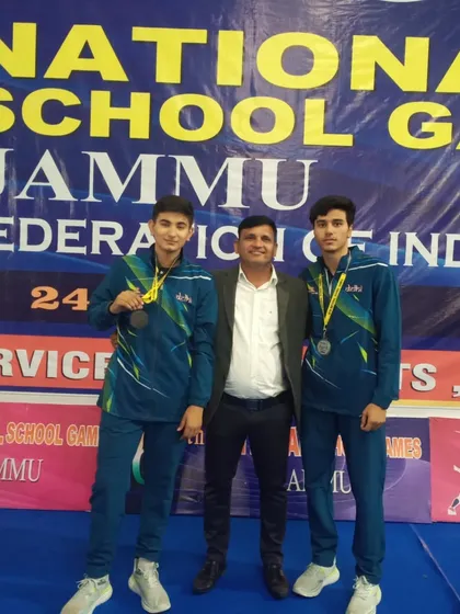 Two of our fencers with their coach after winning medals at the National School Games in Jammu. This is a testament to the successful partnership between our athletes and mentors.