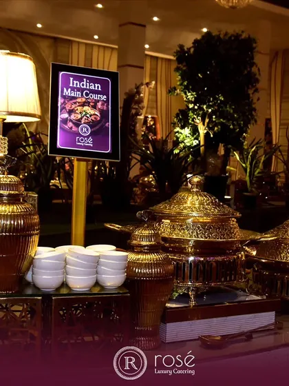 Our Indian main course station, beautifully lit and decorated with ornate golden urns. We promise a symphony of taste that captivates, leaving guests enchanted by the narratives on their plates.