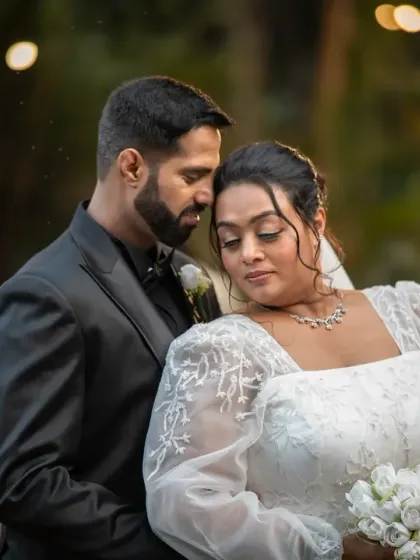 A quiet, romantic portrait of the couple after their ceremony. The soft evening light and their gentle embrace create a beautiful, emotional atmosphere.