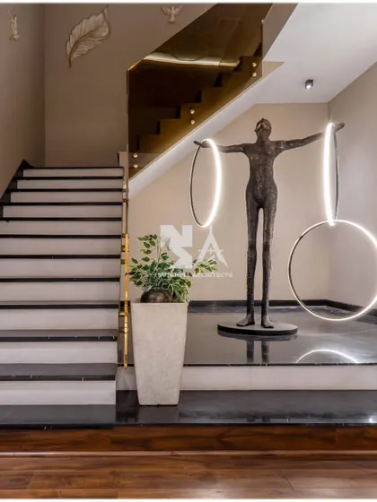 We see staircases as sculptural opportunities. This design features a striking art installation with integrated lighting, transforming a functional element into a captivating focal point that guides you through the home.