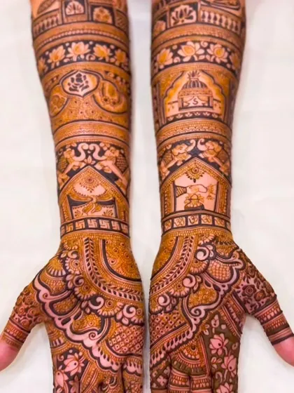A grand bridal design with architectural motifs and traditional patterns. The level of detail makes this a true work of art for a bride's special day.