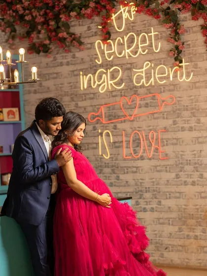 The secret ingredient is love! A sweet maternity moment in our quirky kitchen set, complete with a neon sign.