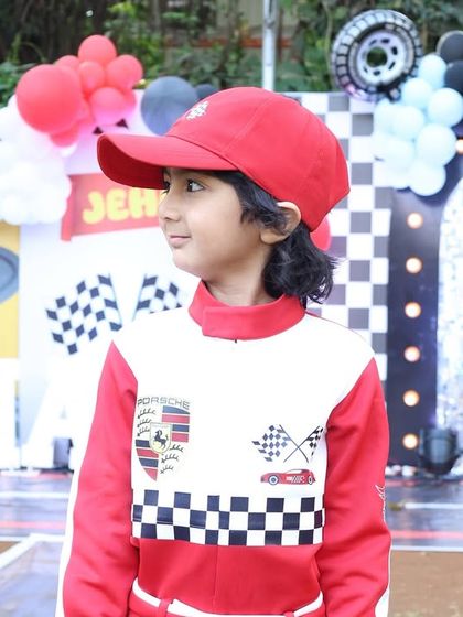 A portrait of the handsome birthday boy in his racing suit. Capturing these moments for the family is so important.