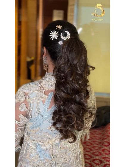 Another angle of the celestial-themed ponytail, highlighting the beautiful curls and accessories.