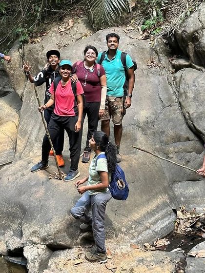 Navigating a tricky river crossing using a fallen log as a bridge. Our guides are always there to assist and ensure everyone crosses safely.