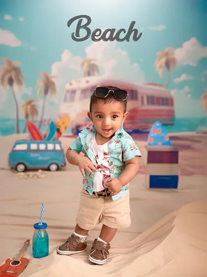 Too cool for the summer. With his sunglasses on, this little guy is making waves during his beach-themed photoshoot, showing off his confident stance.