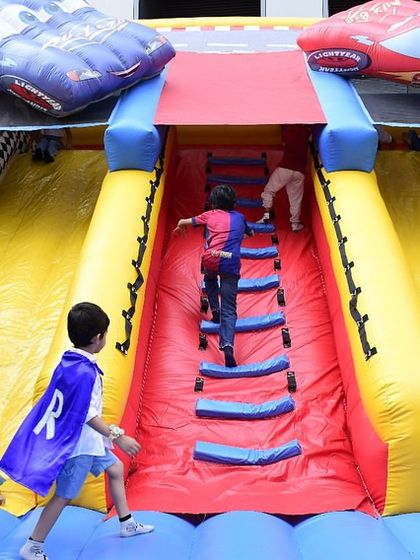 A massive car-themed inflatable slide was the centerpiece of the outdoor fun. It provides hours of entertainment and is a safe way for kids to burn off all that party energy.