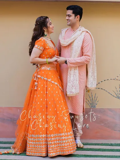 A full-length portrait of the couple, with a romantic "Chasing Sunsets, Chasing Love" overlay.