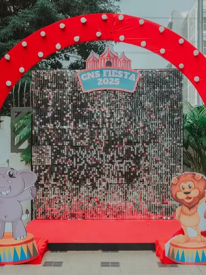 A sparkling photo-op for the CNS Fiesta. This sequin shimmer wall, framed by a red arch and cute elephant and lion characters, was a popular spot for pictures.