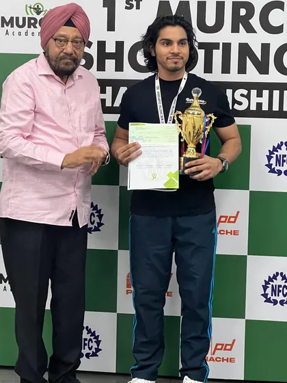 Recognizing our champions is a huge part of the experience. Here, ISSF Air Pistol Champion Anmol Jain receives his trophy and prize money at the 1st MURC Shooting Championship. I believe in rewarding excellence and giving athletes the recognition they've earned.