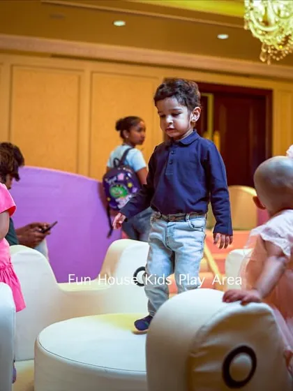 Kids confidently playing on the white merry-go-round, demonstrating its stability and appeal for group play.