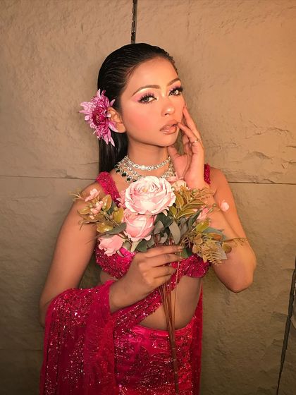 A beautiful portrait of the 'Rosemary' look, showcasing the delicate pink tones in the makeup and the fresh, youthful vibe.