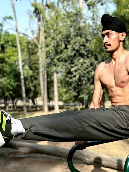 Core strength is non-negotiable. Performing an L-sit on parallel bars is an advanced calisthenics exercise that demonstrates exceptional core and tricep strength.