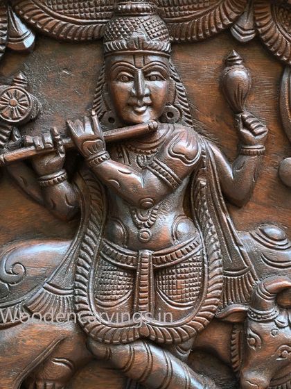 A close-up of Lord Krishna from the 54-inch Kirthi Mukh arch panel, detailing his serene expression and the fine carving of his flute and jewelry.