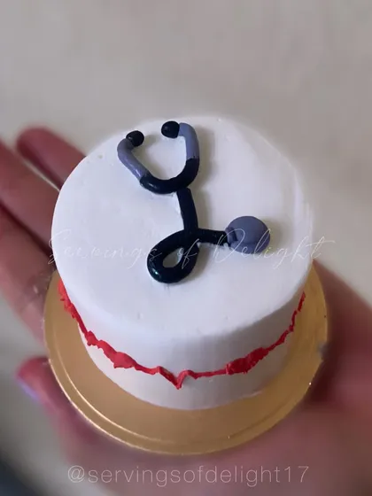 A special mini cake for a doctor. This tiny cake features a hand-piped stethoscope, making it a perfect gift for a medical professional.