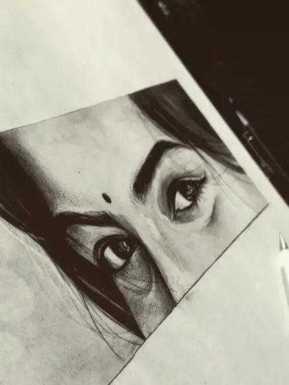 Another look at the beautiful graphite eye sketch. The angle shows the texture of the paper and the fine pencil work.
