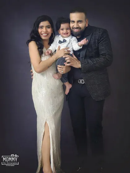 This stylish family looks so elegant in their coordinated outfits for a studio portrait session. A timeless way to capture your family at this stage.