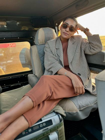 Even a 5 AM safari calls for a chic outfit. Here, I’m showing how to do safari style with a practical-yet-polished vibe, pairing a terracotta co-ord set with a classic checked blazer.