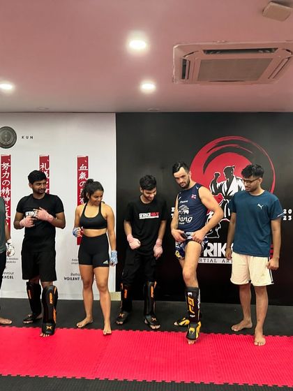 A candid moment of fun and laughter after a tough workout with a guest coach.