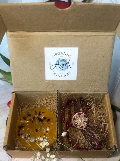 A look inside the Rakhi gift box. The natural fiber filling keeps the soap and Rakhi safe, making it a thoughtful and sustainable gift.