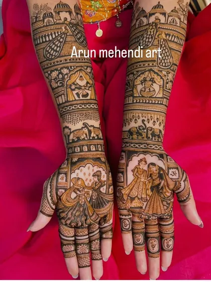 This design captures a playful moment, with figures that look like they are dancing, possibly from a sangeet ceremony.