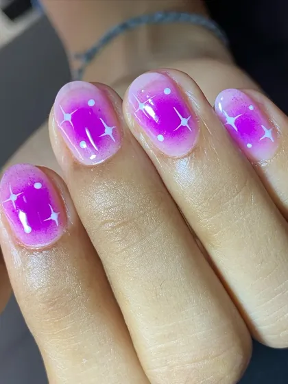 The glossy finish makes these aura nails look like they're glowing from within.
