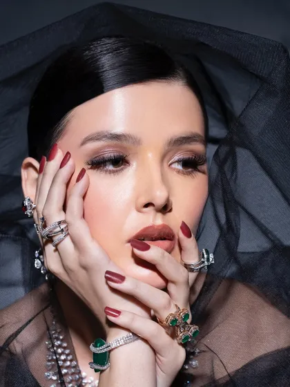 Another look from a fine jewellery shoot. The styling here is dark and moody, allowing the emeralds and diamonds to capture the light. This demonstrates how to use contrast to make accessories pop.