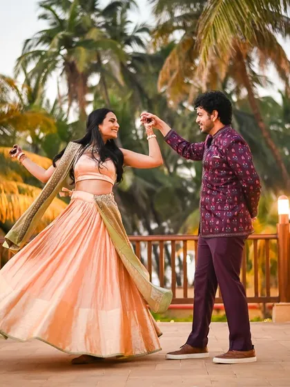 Another frame from Soha and Revant's dance, capturing the beautiful movement of her lehenga and their joyful interaction.