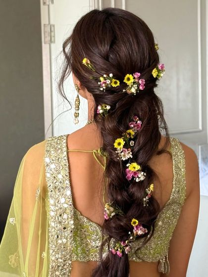 Another angle of the colorful floral braid, highlighting the mix of yellow, pink, and white flowers.