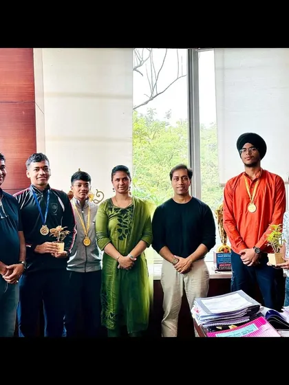 Our state champions with coaches and the NMMC Deputy Municipal Commissioner, discussing the future of boxing in Navi Mumbai.