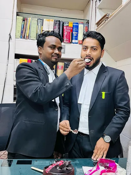 A team member shares in the celebration of my band ceremony.