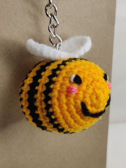 My super popular bumblebee keychains. They come in the classic yellow and black, but I also make them in fun colors like pink, blue, and purple.