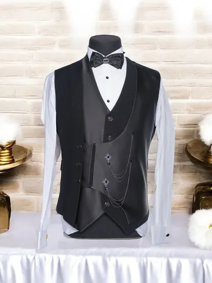 This piece showcases my passion for unique details. It is a custom double-layered waistcoat featuring an asymmetrical cut, satin lapels, and a decorative chain, designed to be a standout element in any formal wardrobe.