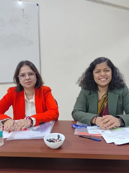 On the judging panel with a fellow legal professional. These events are a great opportunity to assess the practical skills of law students in areas like client counseling.