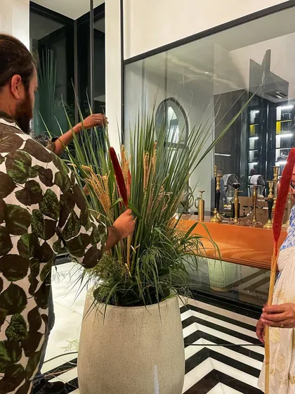 Here's a closer look at my team arranging a large faux grass and cattail installation. These artificial arrangements are perfect for indoor sets where lighting and maintenance are a concern.