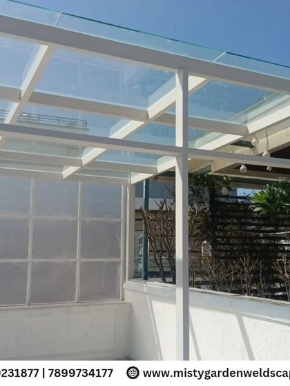 Another angle of the 10mm toughened glass pergola at NVT Orchid Garden. The white frame gives it a clean and contemporary look, perfectly complementing the modern villa architecture.