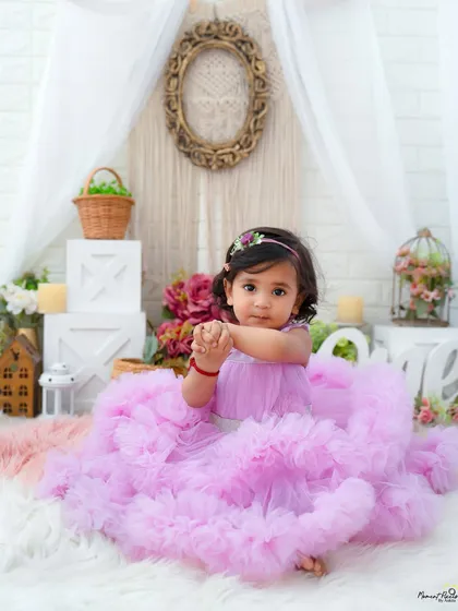 A princess in her own fairytale. This little girl in her lavender gown looks so sweet and thoughtful during her milestone photoshoot.