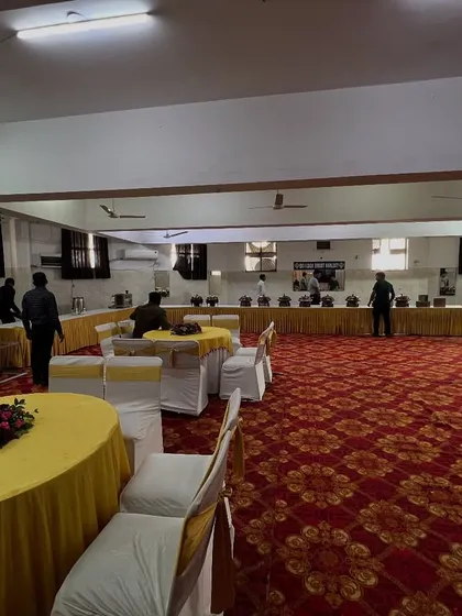 A simple banquet hall setup with guest seating and a buffet line. I can handle basic arrangements for any type of event.