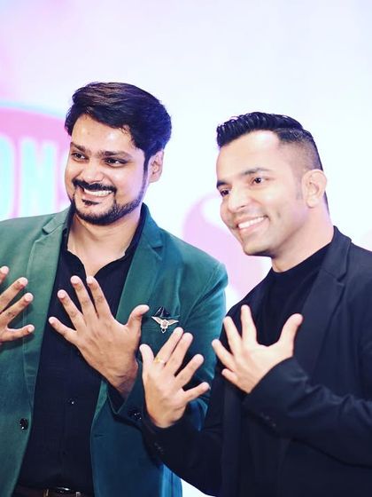 A fun, candid moment on stage. My goal is to be more than just an anchor; I aim to be a part of the celebration, sharing in the joy of the event.