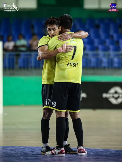A hug of relief and celebration between two players after the semi-final.