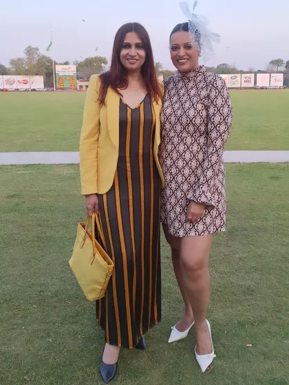 With a friend at the polo grounds. My retro-inspired printed dress and fascinator were a playful nod to classic polo fashion.