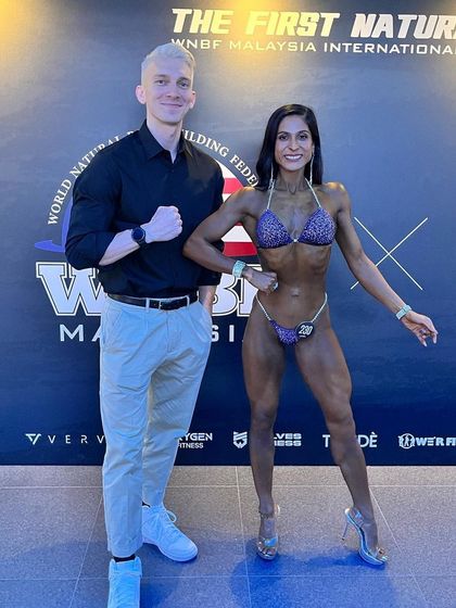 A proud moment with my coach after placing 4th at the WNBF Malaysia competition. His guidance was invaluable in helping me navigate the challenges of an international pro-qualifier show.