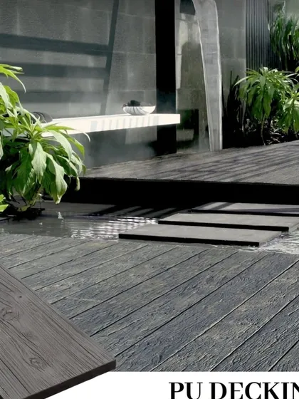 A stunning zen garden concept featuring dark PU decking around a water element. The material is completely waterproof, making it ideal for poolside or waterside applications.