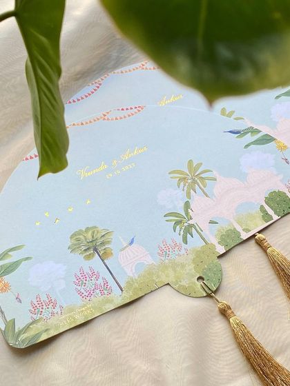 A different view of the fan programs, showing the golden tassels that finish them beautifully. These are both practical and a lovely keepsake for guests.