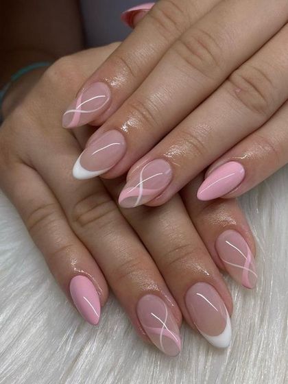 Another angle of this delicate pink and white abstract design, showing the combination of different styles in one cohesive manicure.