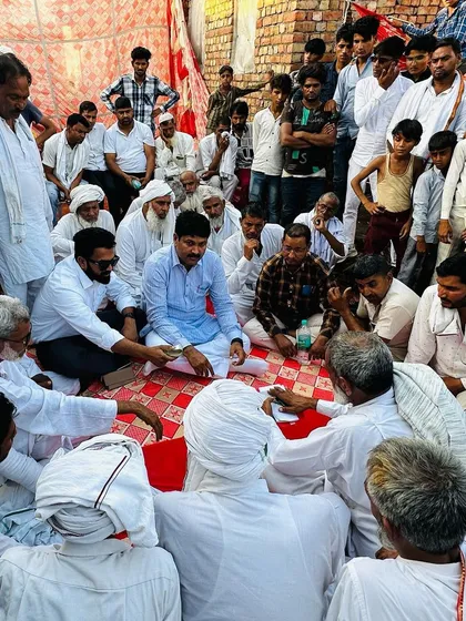 Sitting with the elders and community members at a village wedding in Adbar, Nuh. Being part of the community's joys and sorrows is fundamental to my role as their representative.